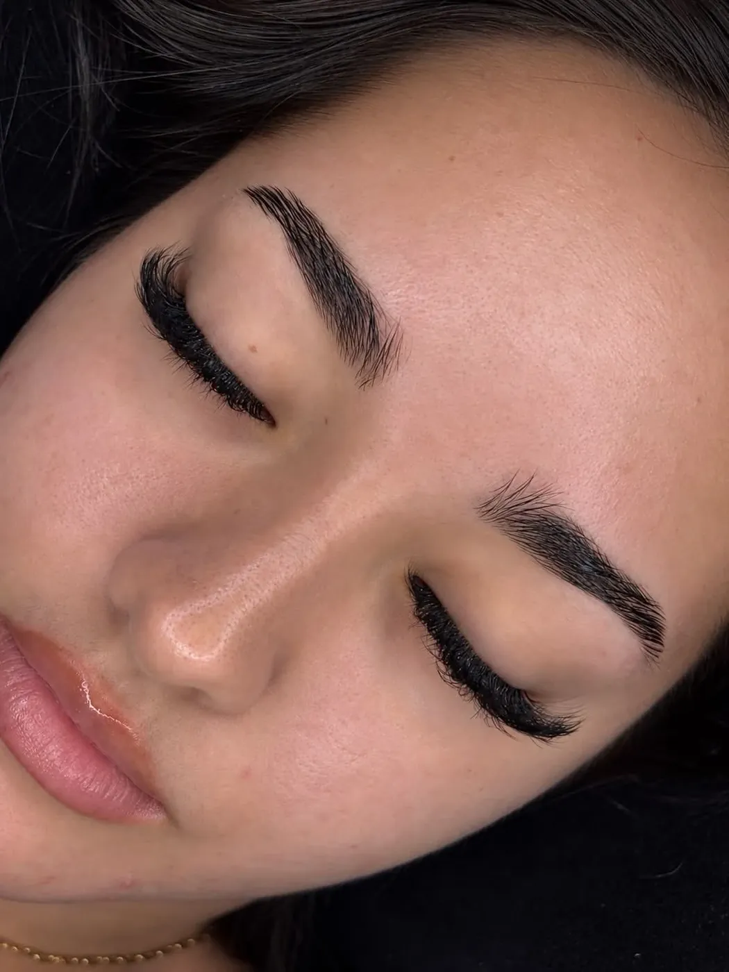 A volume lash set, eyes closed