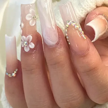 Milky ombré square nails with white 3D flowers and crystals