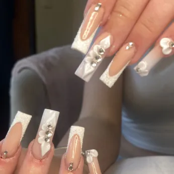 Square French tips with glitter edges, rhinestones and white 3D hearts